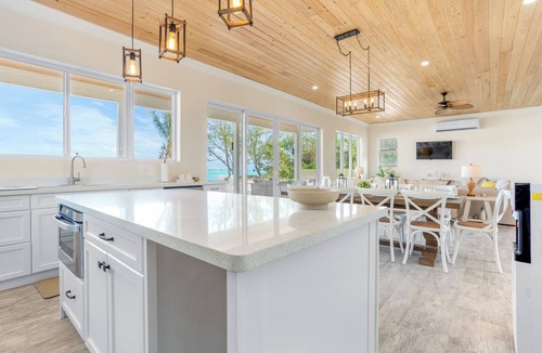 Rolleville Villa | Boundless, beachfront, walk to Cocoplum sandbars & restaurants via the beach!