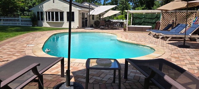 Charming Split-Level House with heated pool, hot tub & a brand-new septic system in Hampton Bays