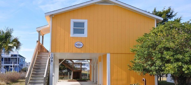Coastal bungalow charm with dock, porch views, and easy beach access in a renovated retreat
