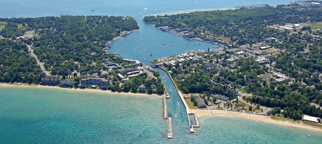 Penthouse Condo on the channel. Stunning views, walk to beach, watch the boats.