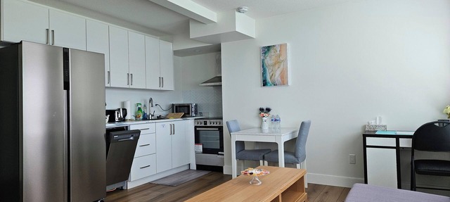 Private south-facing suite with a full bathroom and fully equipped kitchen. in Coquitlam